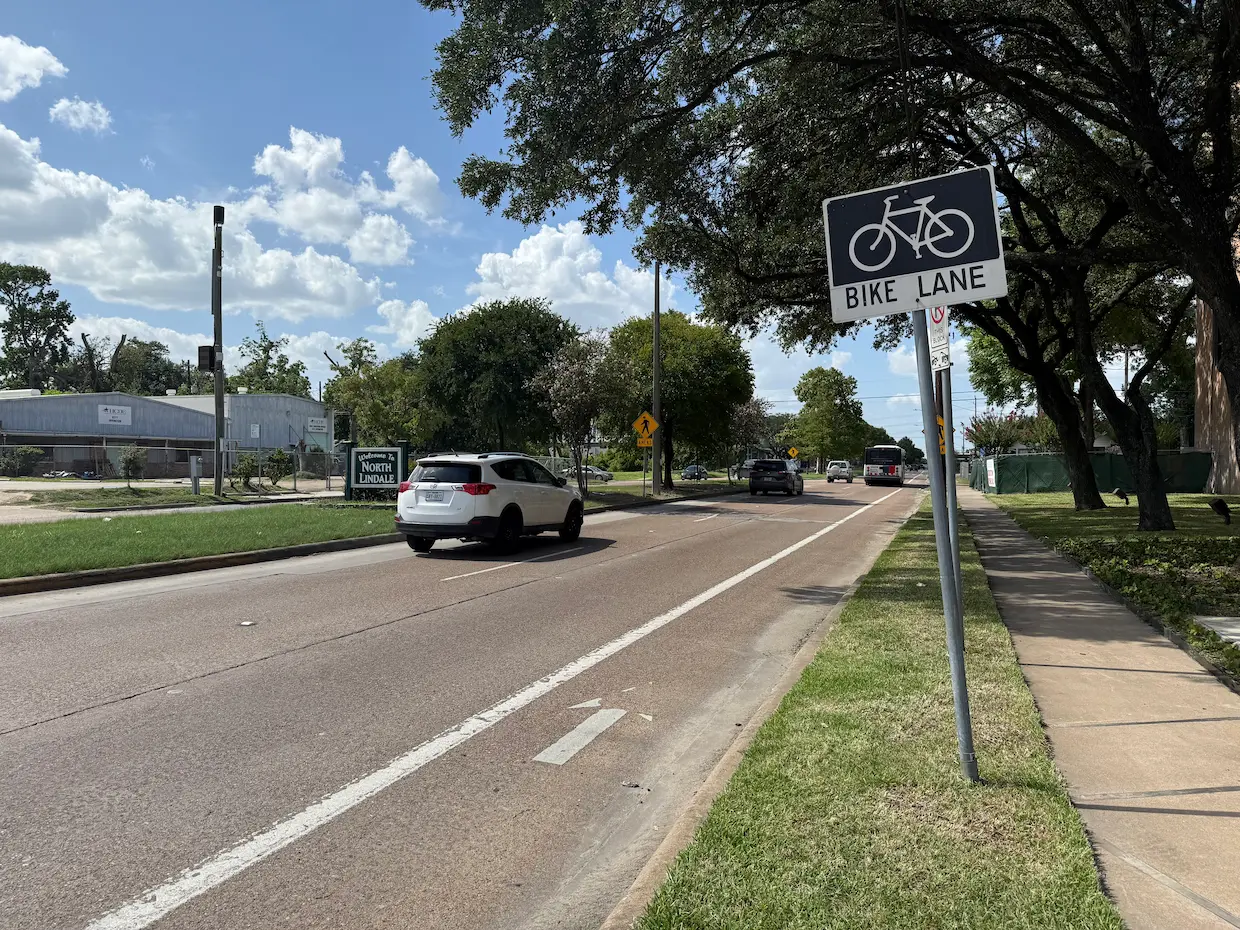 A street with cars stopped at a red light